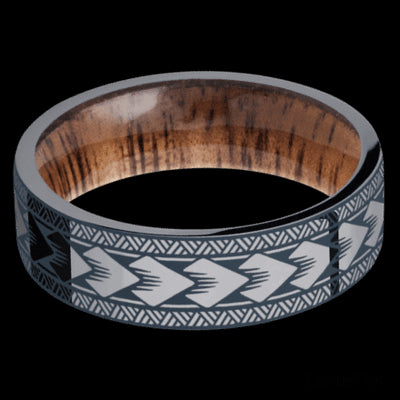 7 mm wide/Flat/Tantalum band with a laser carved Maori pattern also featuring a Koa sleeve.